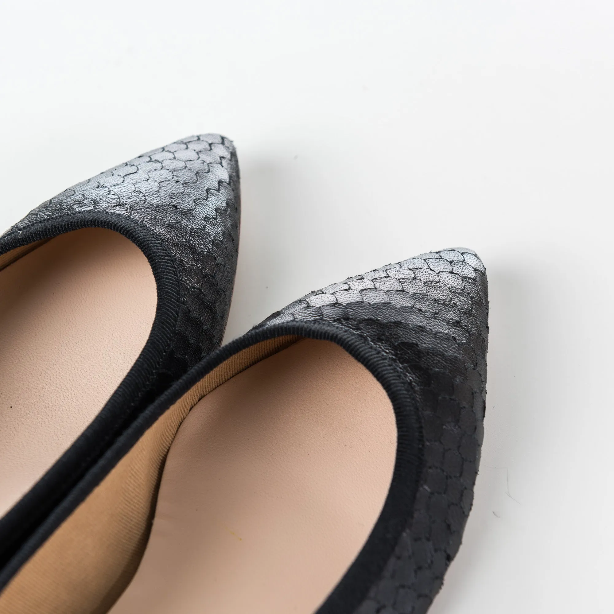 Black leather pointed toe ballet flats with cobra-skin effect